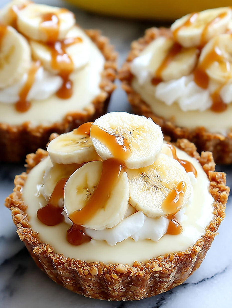 A close up of a banana cream pie with caramel drizzle.
