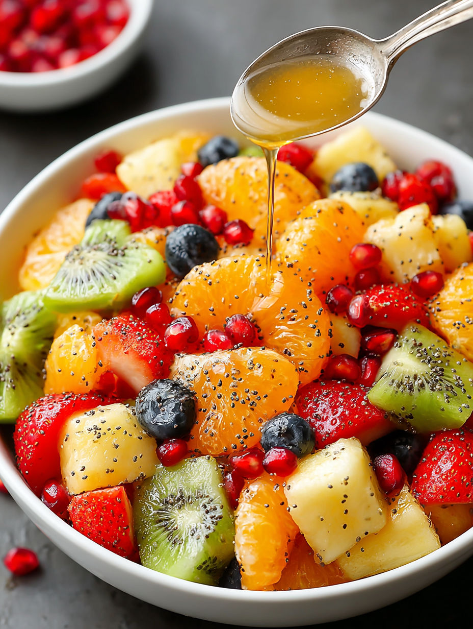 A bowl of fruit salad with orange, blueberry, kiwi, and pineapple.