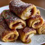A stack of cinnamon french toast roll-ups.