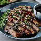 A plate of steak with balsamic glaze.