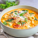 A bowl of Tuscan chicken soup with noodles and vegetables.