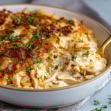 A bowl of French Onion Chicken Orzo Casserole.