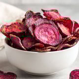 A bowl of beet chips.