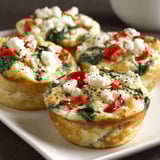 Three muffins with spinach and feta cheese.