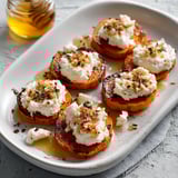 Sweet potato rounds with whipped cottage cheese and hot honey.