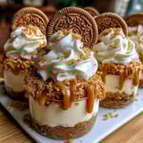 Cookie butter cheesecake cups with whipped cream.