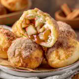 A plate of air fryer apple pie bombs.
