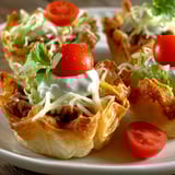 A plate of taco dip bites.