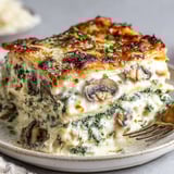 A large piece of spinach mushroom white lasagna.