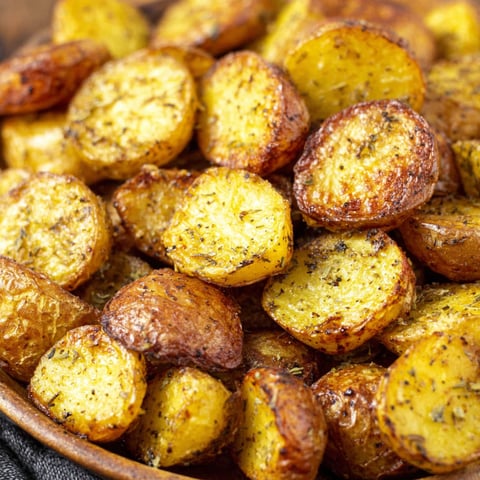 A bowl of roasted potatoes.