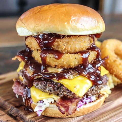 A BBQ Bacon Beer Onion Burger with a side of fries.
