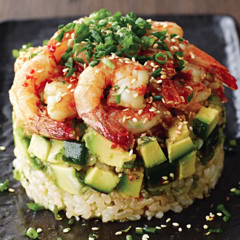A spicy California shrimp stack on a plate.