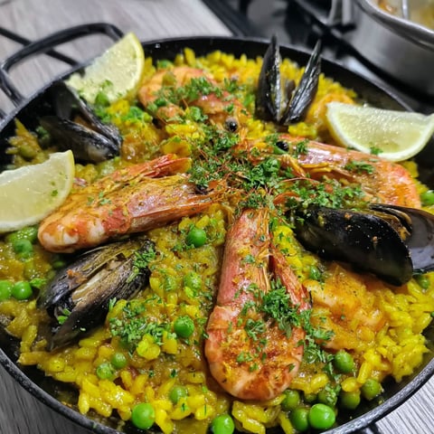 A skillet full of seafood paella.